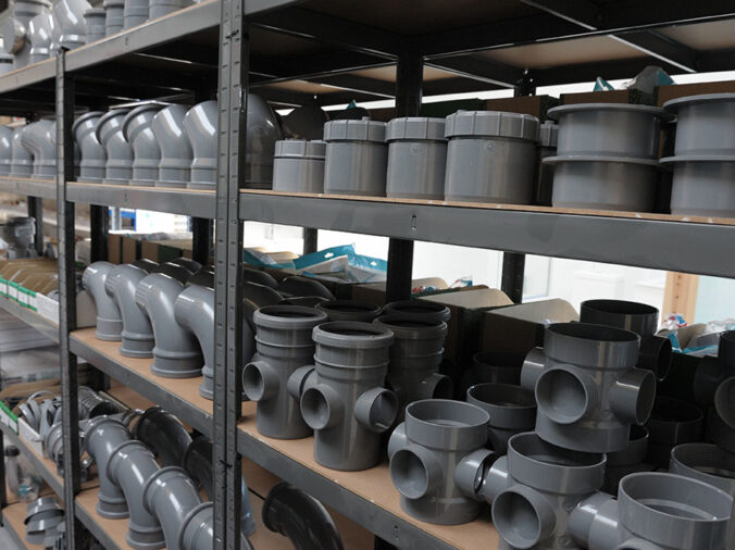 Large Grey commercial PVC fittings and elbos in a plumbing warehouse