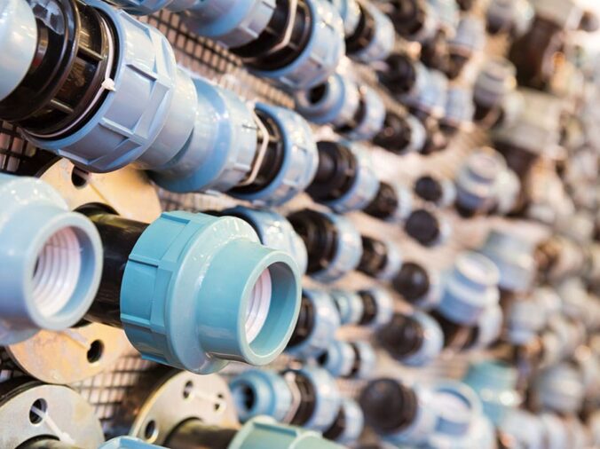 PVC unions on display in a plumbing store