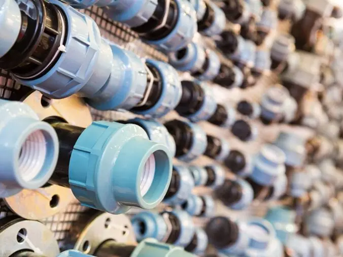 PVC unions on display in a plumbing store